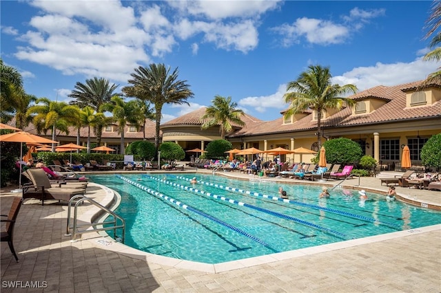 community pool with a patio area