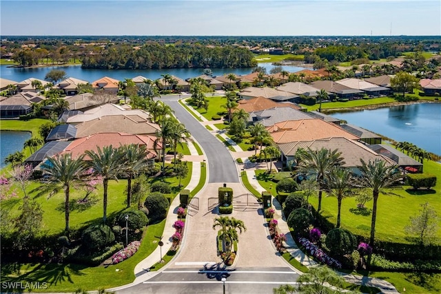 bird's eye view featuring a water view and a residential view