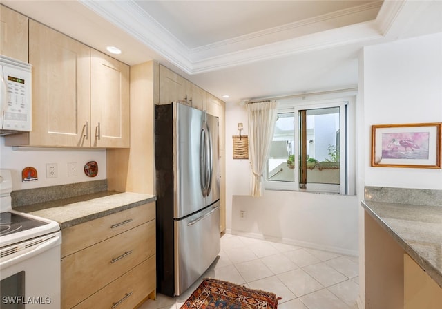 kitchen featuring light tile patterned flooring, white appliances, baseboards, ornamental molding, and light brown cabinetry