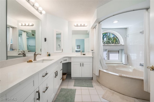 bathroom with tile patterned flooring, a washtub, walk in shower, and vanity