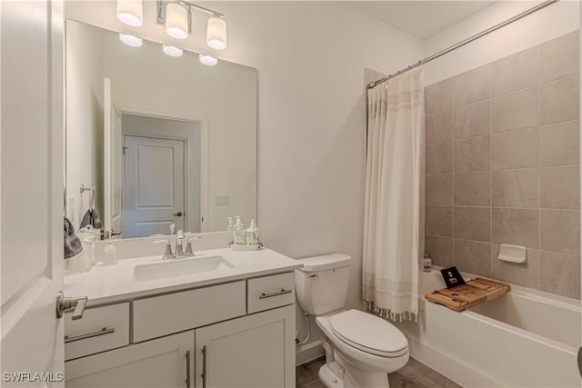 bathroom with toilet, shower / bath combo, and vanity