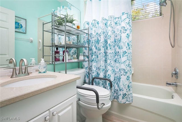 bathroom with toilet, shower / tub combo with curtain, and vanity