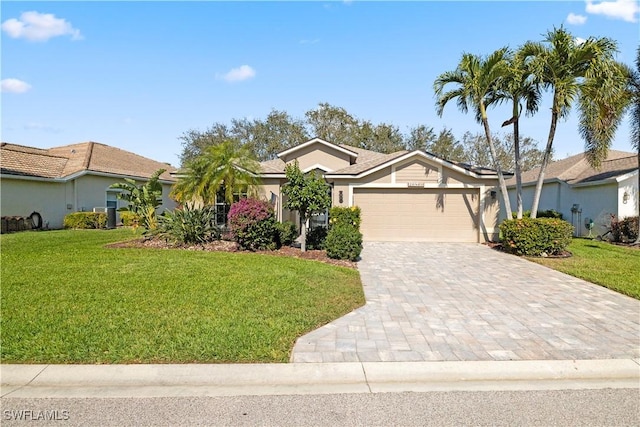 20860 Rivers Frd, Estero, FL 33928 - single story home with a garage, a front lawn, decorative driveway, and stucco siding