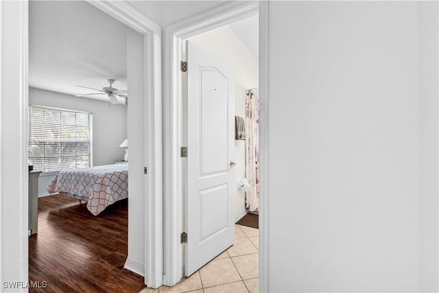 hallway featuring light tile patterned flooring