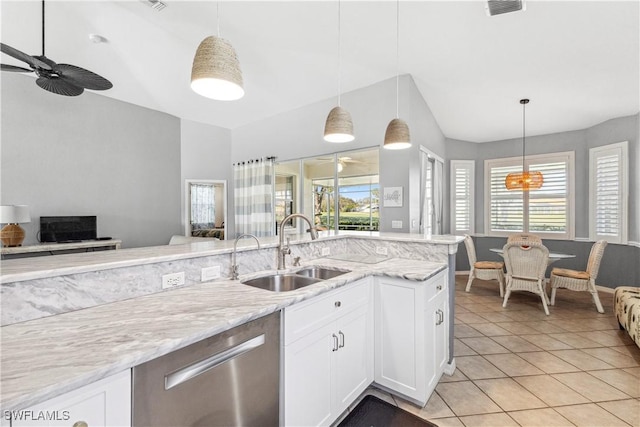 kitchen with a sink, open floor plan, dishwasher, and hanging light fixtures