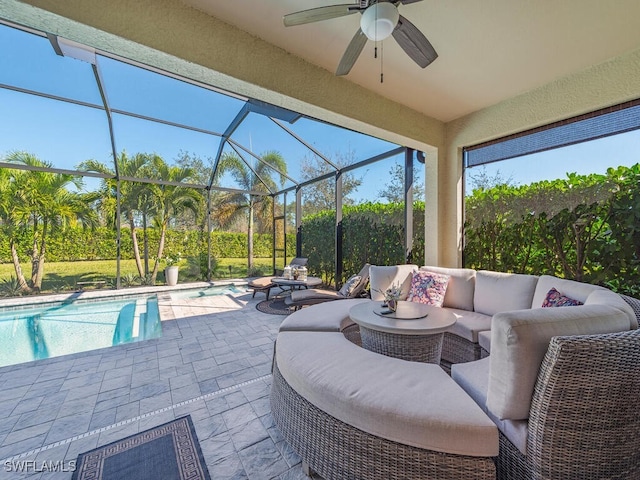 view of patio with an outdoor pool, glass enclosure, an outdoor living space, and a ceiling fan