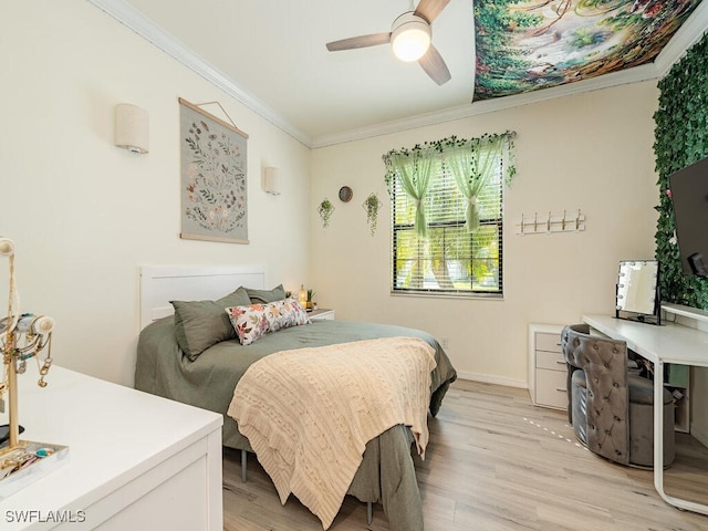 bedroom featuring ornamental molding, light wood-type flooring, a ceiling fan, and baseboards