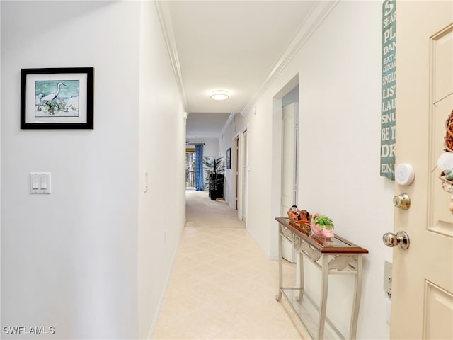 hall featuring ornamental molding and baseboards