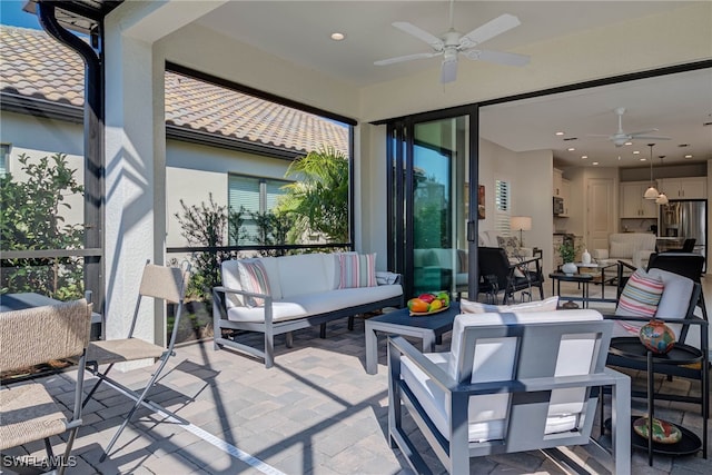 view of patio / terrace with ceiling fan and outdoor lounge area