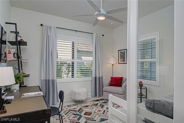 office area with a ceiling fan