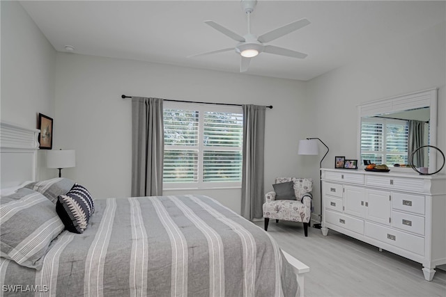 bedroom with light wood-type flooring and a ceiling fan