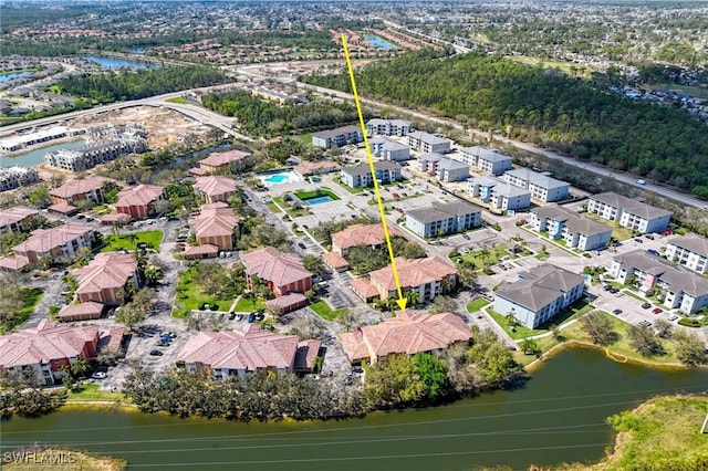 aerial view with a water view and a residential view