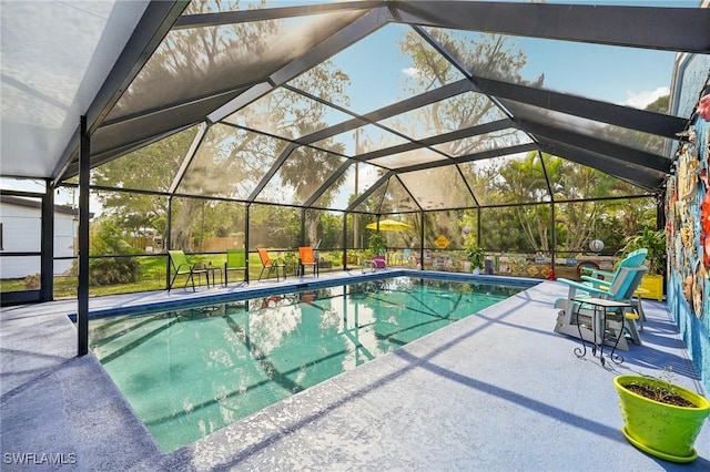 pool with a patio and a lanai