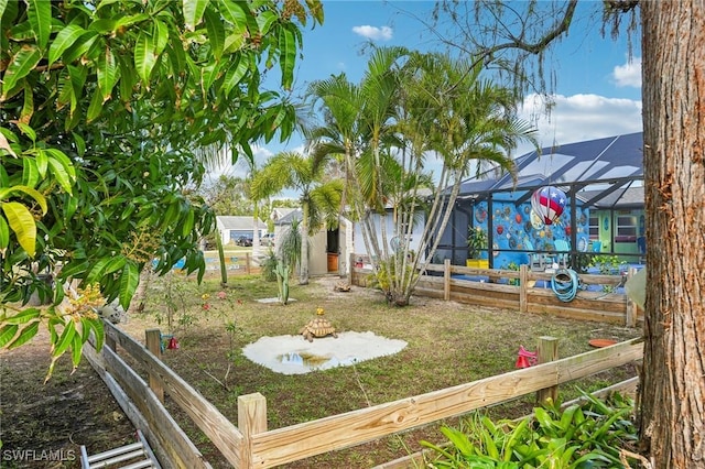 view of yard with a lanai