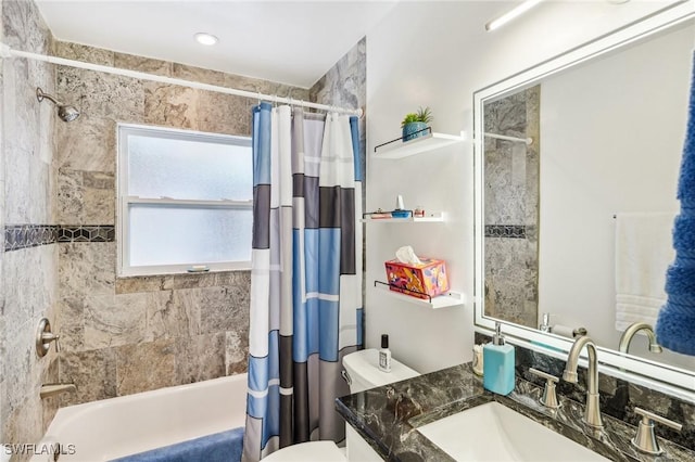 full bathroom featuring toilet, shower / bath combo, and vanity