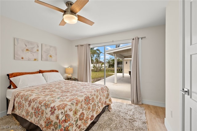 bedroom with access to exterior, light wood-style flooring, baseboards, and a ceiling fan