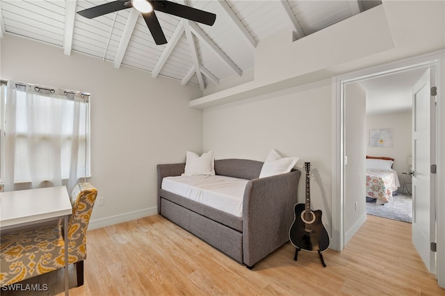 bedroom with vaulted ceiling with beams, ceiling fan, wood ceiling, baseboards, and light wood-style floors