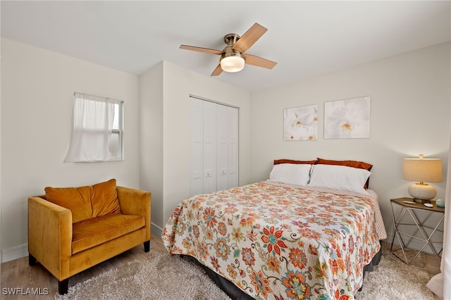 bedroom featuring a ceiling fan, a closet, and baseboards