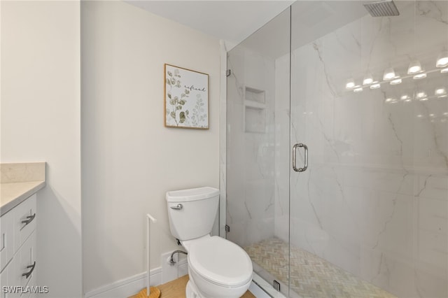 full bath with toilet, a marble finish shower, baseboards, and vanity