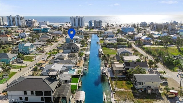 aerial view with a city view and a water view