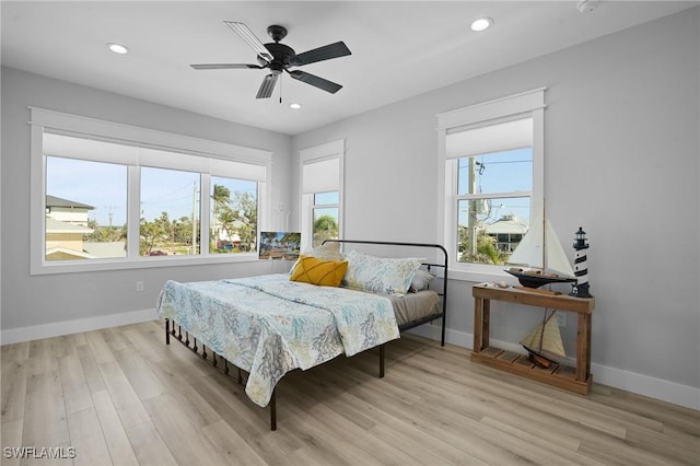 bedroom featuring recessed lighting, ceiling fan, baseboards, and wood finished floors