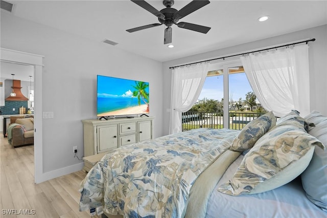 bedroom featuring access to exterior, visible vents, baseboards, and light wood-style floors