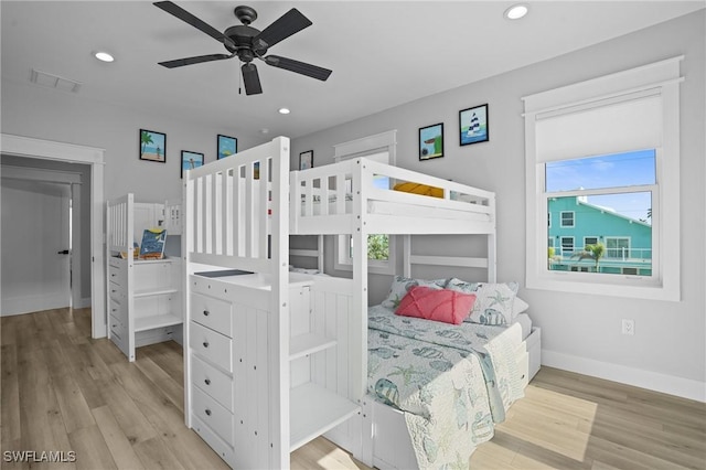 bedroom with wood finished floors, visible vents, baseboards, recessed lighting, and ceiling fan