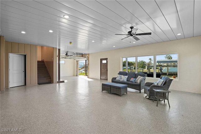 living room with recessed lighting, speckled floor, stairs, and a ceiling fan