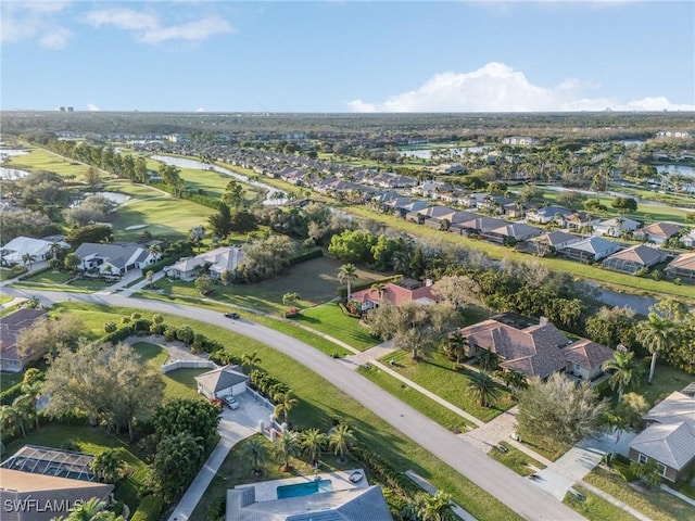 birds eye view of property featuring a water view and a residential view