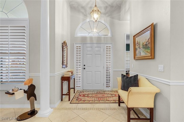 tiled entrance foyer with baseboards