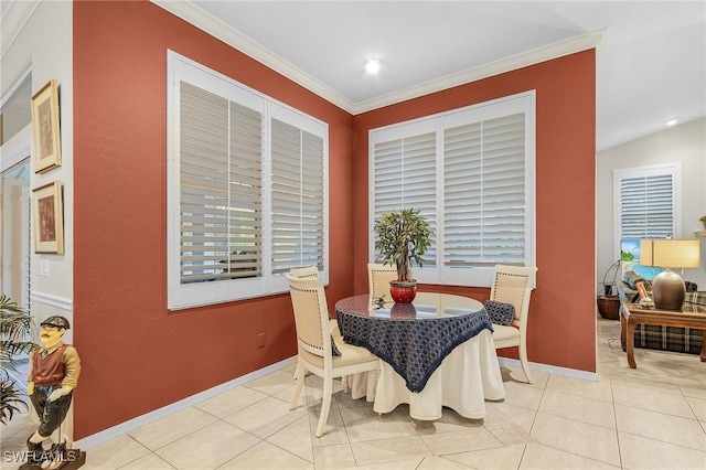 dining room with light tile patterned floors, baseboards, crown molding, and recessed lighting