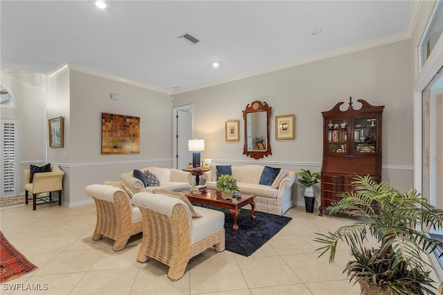 living area with ornamental molding, light tile patterned flooring, and visible vents