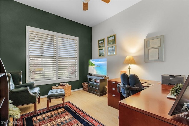 office area featuring baseboards and a ceiling fan