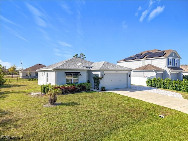 view of front of property featuring a garage, concrete driveway, a front lawn, and fence