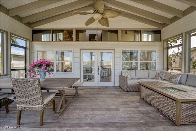 sunroom / solarium with lofted ceiling with beams, ceiling fan, and french doors