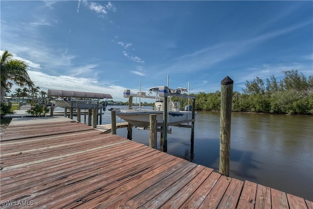 dock area featuring a water view and boat lift