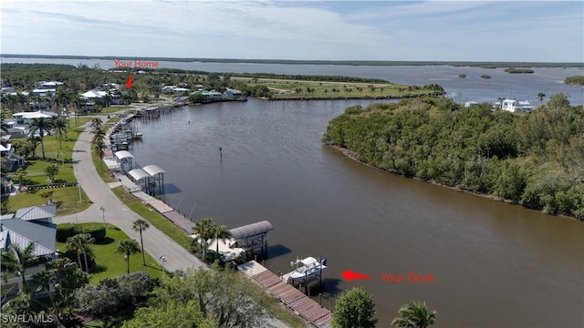 birds eye view of property with a water view