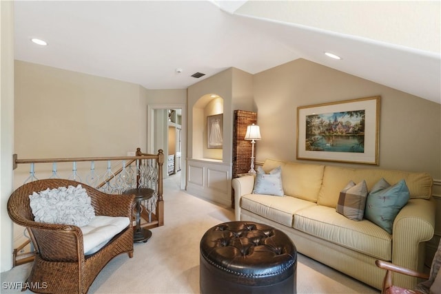 living area featuring a wainscoted wall, recessed lighting, visible vents, carpet flooring, and vaulted ceiling