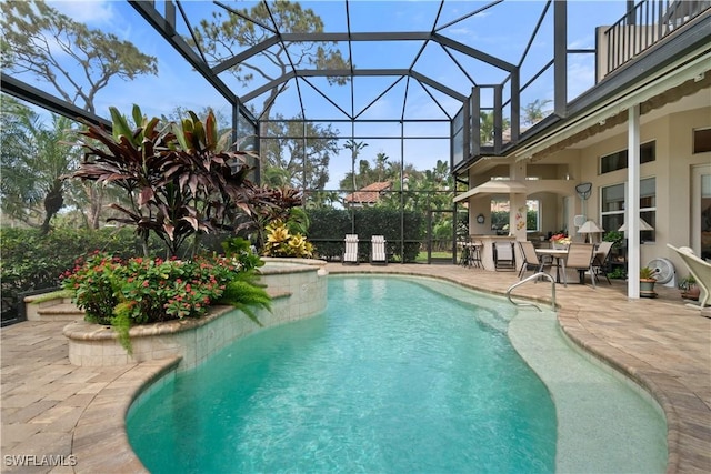 pool featuring a lanai and a patio