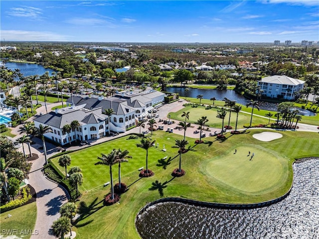 birds eye view of property featuring view of golf course and a water view