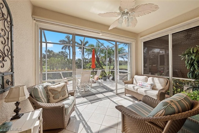 sunroom / solarium featuring ceiling fan