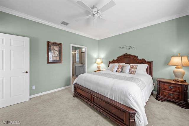 bedroom with light carpet, baseboards, a ceiling fan, connected bathroom, and ornamental molding