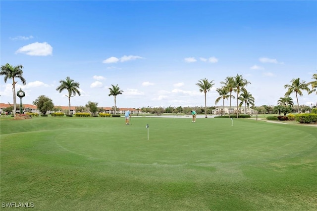 view of property's community with view of golf course