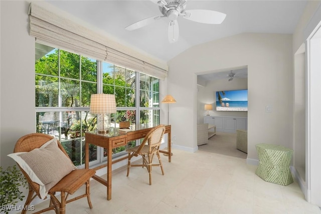 home office with baseboards, a ceiling fan, and vaulted ceiling