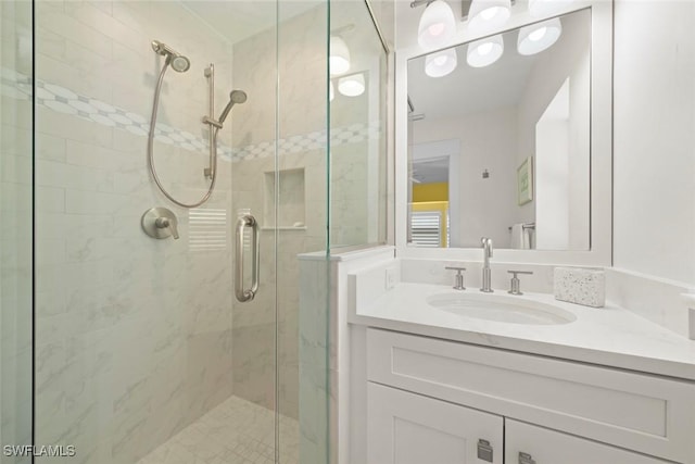 bathroom featuring vanity and a stall shower