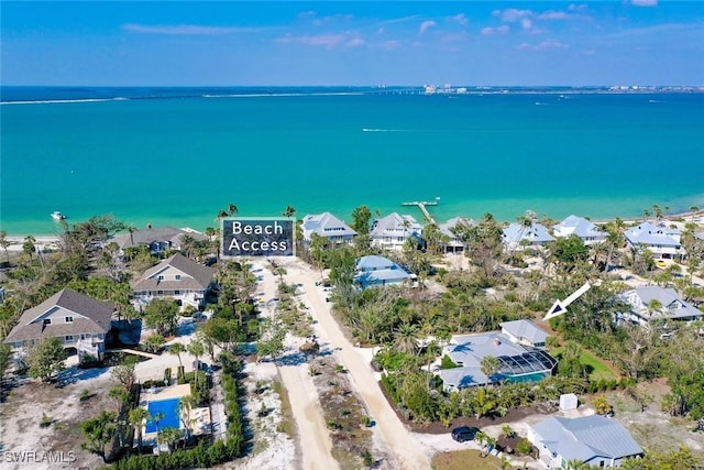 drone / aerial view featuring a residential view and a water view