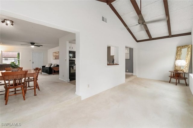 interior space featuring visible vents, a ceiling fan, and light colored carpet