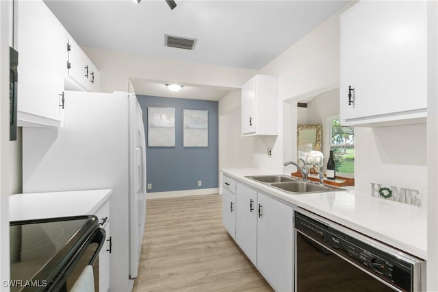 kitchen featuring visible vents, light countertops, black appliances, white cabinetry, and a sink