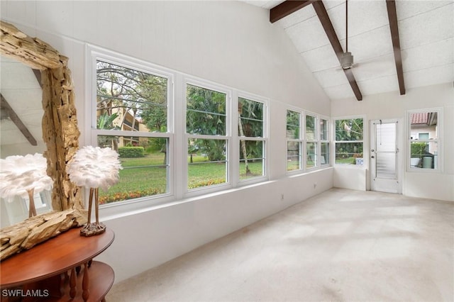 sunroom with vaulted ceiling with beams and ceiling fan