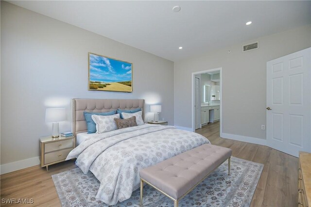 bedroom with baseboards, recessed lighting, visible vents, and light wood-style floors